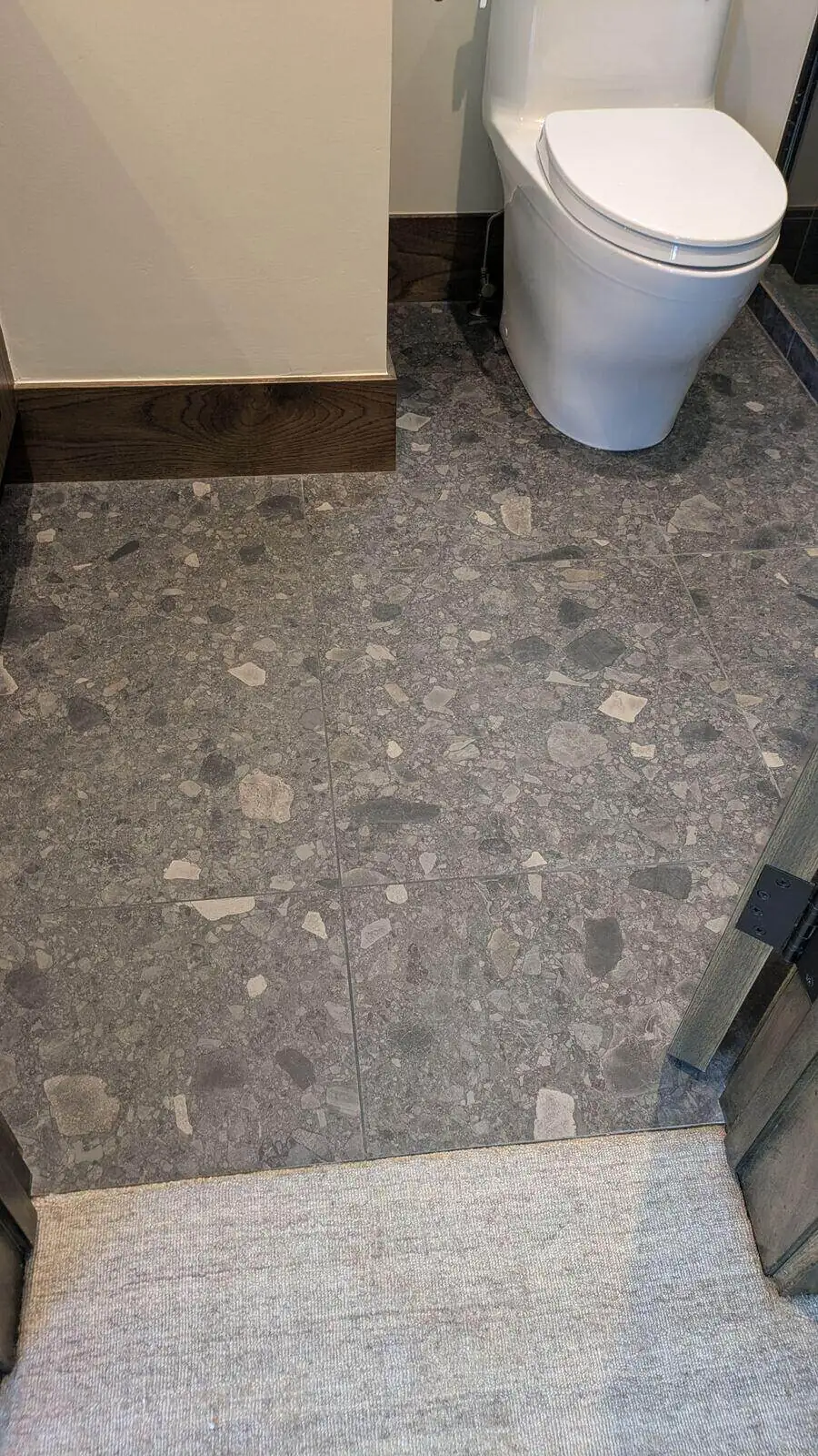 Natural stone pebble mosaic floor installation