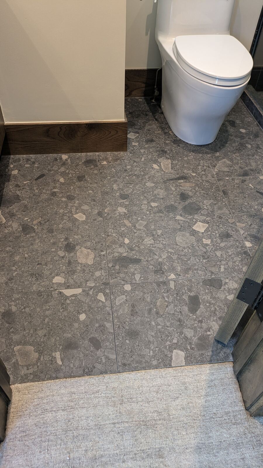 Natural stone pebble mosaic floor installation